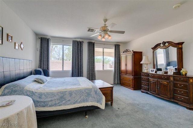 bedroom with light colored carpet and ceiling fan