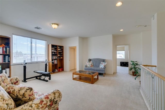 carpeted living room featuring recessed lighting