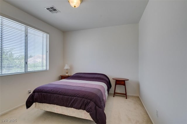 carpeted bedroom with baseboards