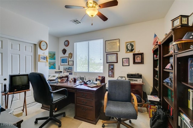 office with ceiling fan and light colored carpet
