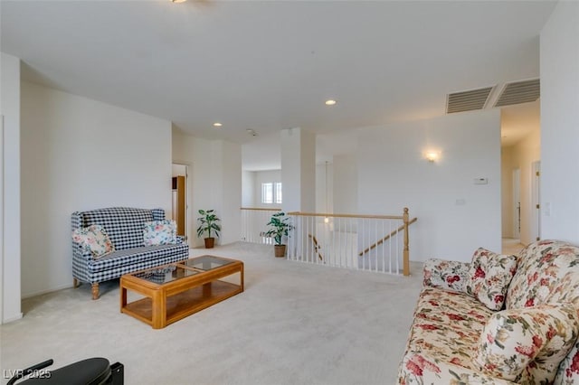 living room featuring carpet and recessed lighting