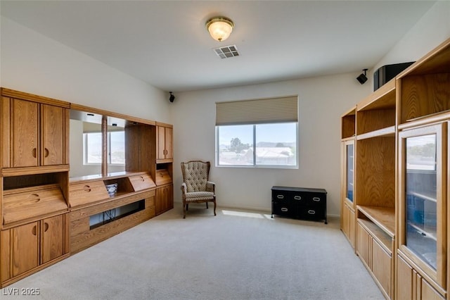 sitting room with light colored carpet