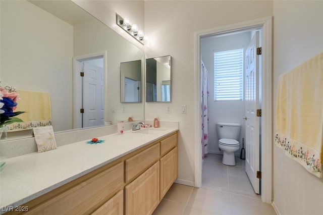 full bathroom featuring tile patterned floors, vanity, toilet, and baseboards