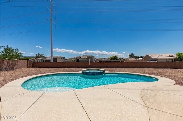 view of pool with a fenced backyard, a pool with connected hot tub, and a patio