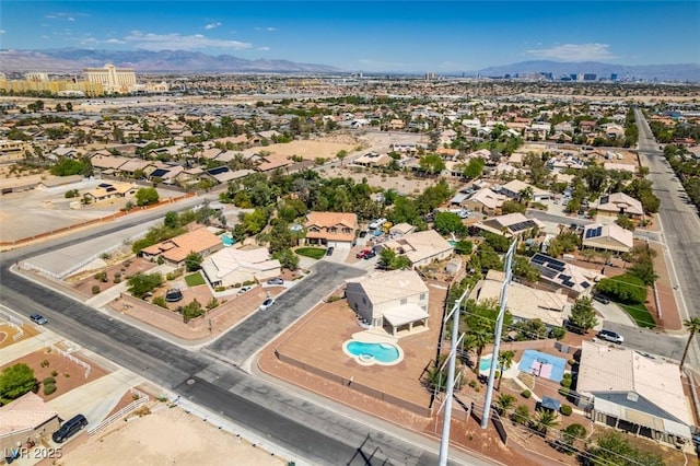 aerial perspective of suburban area with a mountainous background