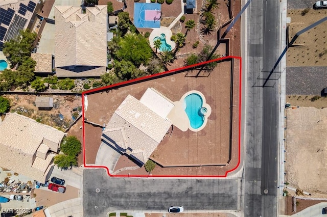 aerial view of property's location with a pool and property parcel outlined