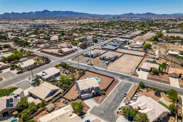 aerial perspective of suburban area with a mountainous background