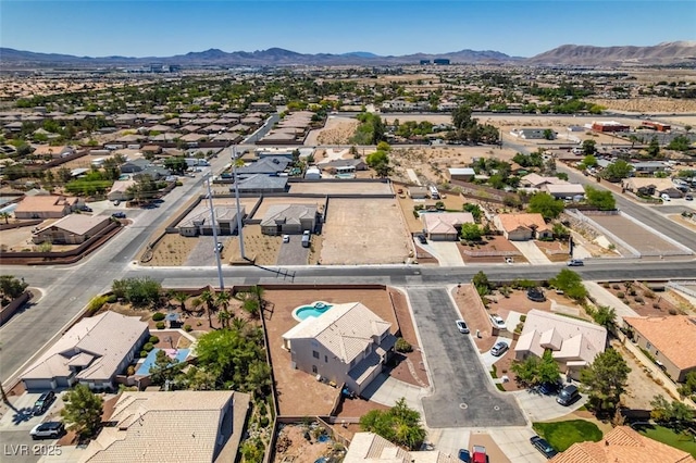 aerial perspective of suburban area with a mountainous background