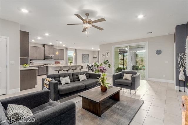 5741 N Park St, Las Vegas, NV 89149 - living room featuring a ceiling fan, baseboards, recessed lighting, and light tile patterned flooring