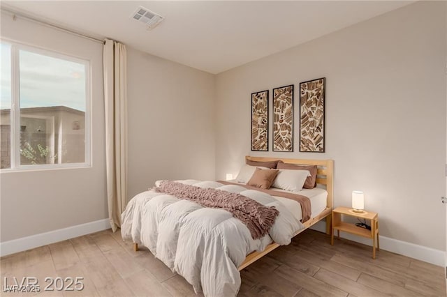 5741 N Park St, Las Vegas, NV 89149 - bedroom featuring light wood-type flooring, visible vents, and baseboards
