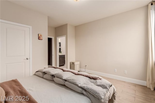 5741 N Park St, Las Vegas, NV 89149 - bedroom featuring baseboards and light wood-type flooring