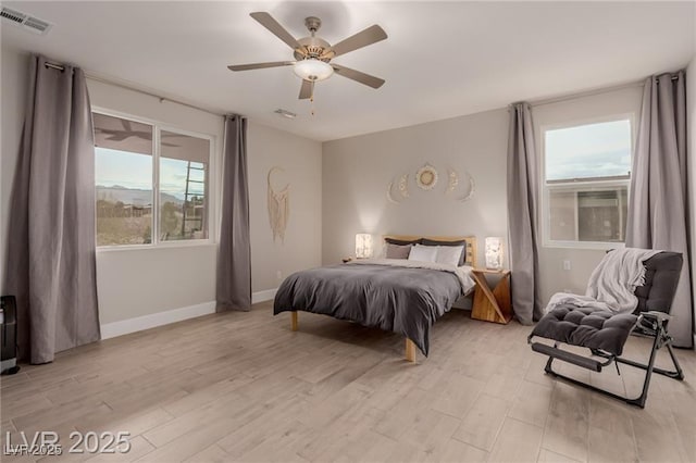 5741 N Park St, Las Vegas, NV 89149 - bedroom featuring light wood-type flooring, visible vents, baseboards, and ceiling fan