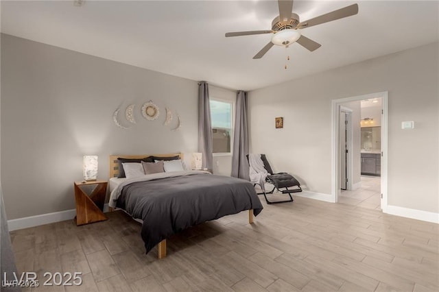 5741 N Park St, Las Vegas, NV 89149 - bedroom featuring baseboards, ensuite bath, light wood-type flooring, and a ceiling fan