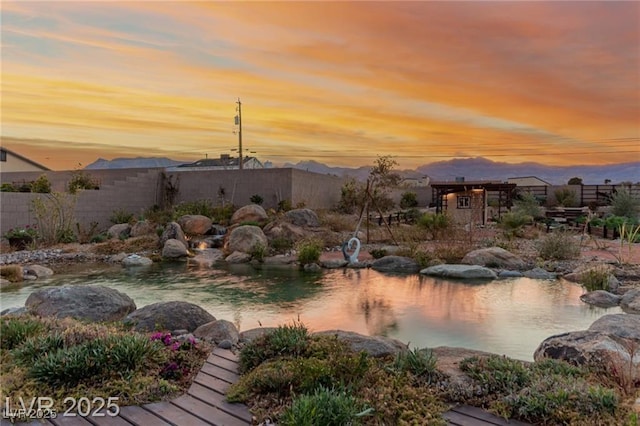 5741 N Park St, Las Vegas, NV 89149 - exterior space featuring fence and a garden pond