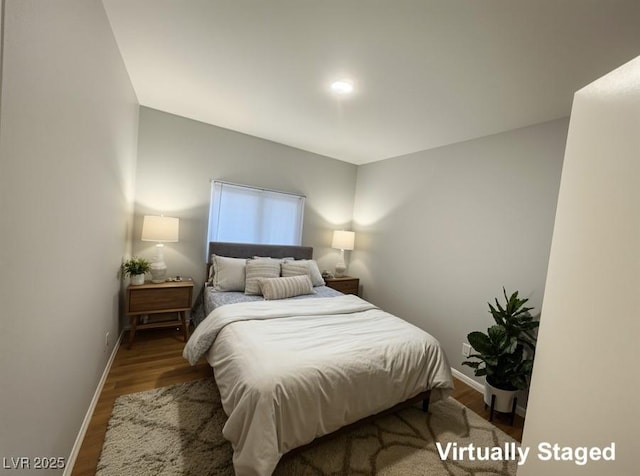 1881 W Alexander Rd Unit 1035, North Las Vegas, NV 89032 - bedroom with baseboards and wood finished floors