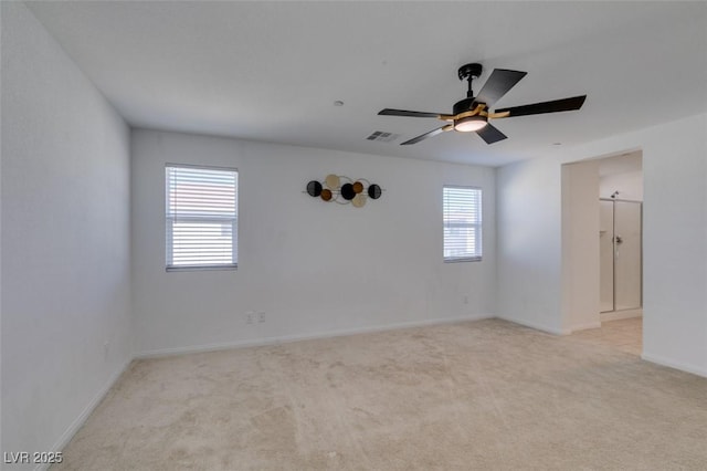 528 Sunny Pointe St, Henderson, NV 89011 - spare room featuring light colored carpet, ceiling fan, and baseboards