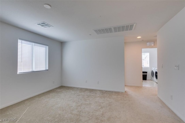 528 Sunny Pointe St, Henderson, NV 89011 - unfurnished room with washing machine and dryer, light colored carpet, baseboards, and recessed lighting