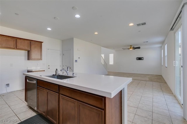 528 Sunny Pointe St, Henderson, NV 89011 - kitchen with stainless steel dishwasher, light tile patterned floors, a sink, a ceiling fan, and recessed lighting