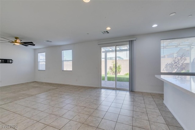 528 Sunny Pointe St, Henderson, NV 89011 - unfurnished room with light tile patterned floors, a ceiling fan, recessed lighting, light colored carpet, and baseboards