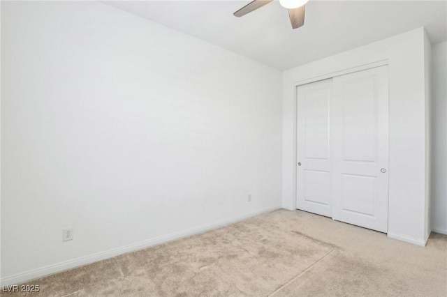 8724 Scalpay St, Las Vegas, NV 89166 - unfurnished bedroom with light carpet, baseboards, a closet, and a ceiling fan