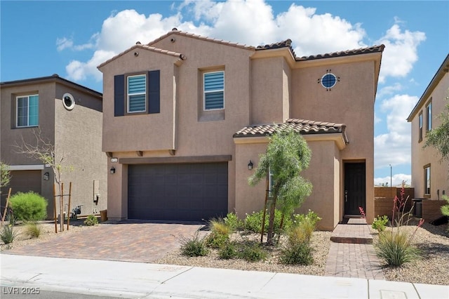 8724 Scalpay St, Las Vegas, NV 89166 - mediterranean / spanish-style home featuring a tiled roof, a garage, stucco siding, and decorative driveway