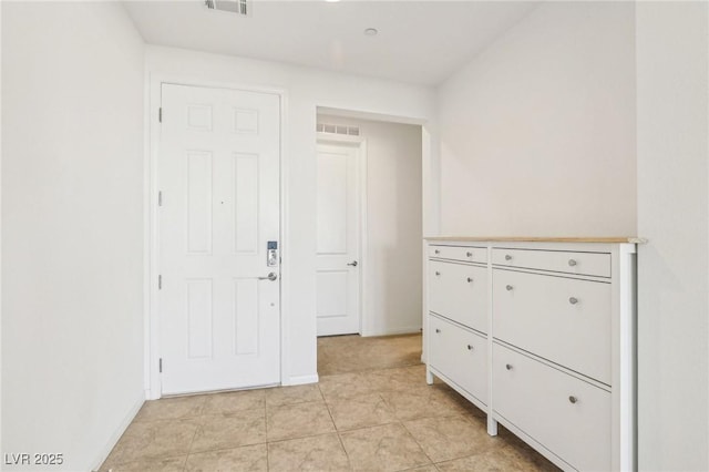 8724 Scalpay St, Las Vegas, NV 89166 - entryway with light tile patterned flooring and baseboards