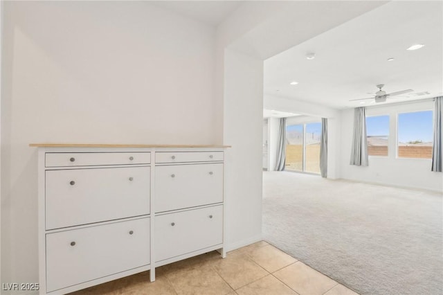 8724 Scalpay St, Las Vegas, NV 89166 - hallway with light colored carpet, light tile patterned floors, and recessed lighting