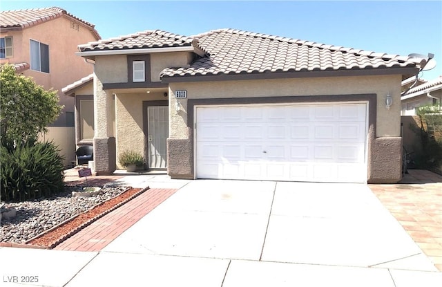 6030 Halehaven Dr, Las Vegas, NV 89110 - mediterranean / spanish-style house featuring driveway, a garage, and stucco siding