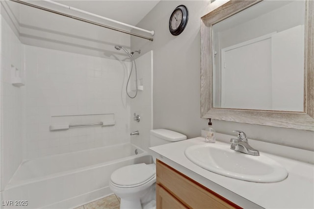 bathroom featuring toilet, tile patterned flooring, vanity, and washtub / shower combination