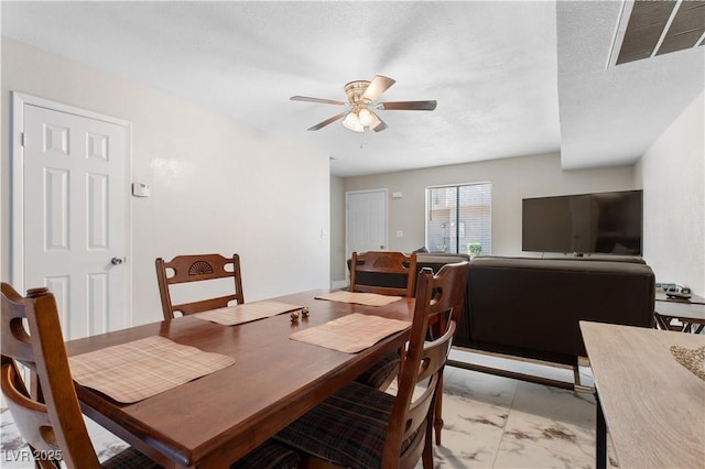 5939 Vegas Dr, Las Vegas, NV 89108 - dining area with marble finish floor, ceiling fan, and visible vents