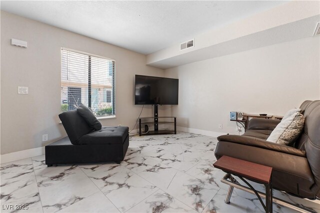 5939 Vegas Dr, Las Vegas, NV 89108 - living room featuring baseboards, marble finish floor, and visible vents