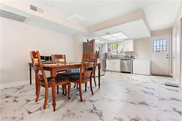 5939 Vegas Dr, Las Vegas, NV 89108 - dining area featuring baseboards, marble finish floor, and visible vents