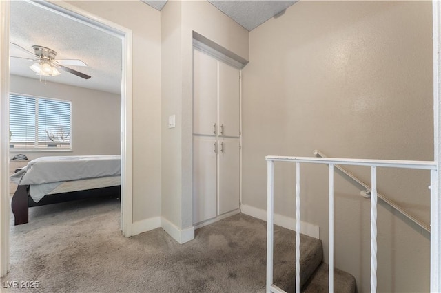 5939 Vegas Dr, Las Vegas, NV 89108 - hallway featuring a textured ceiling, carpet flooring, and baseboards