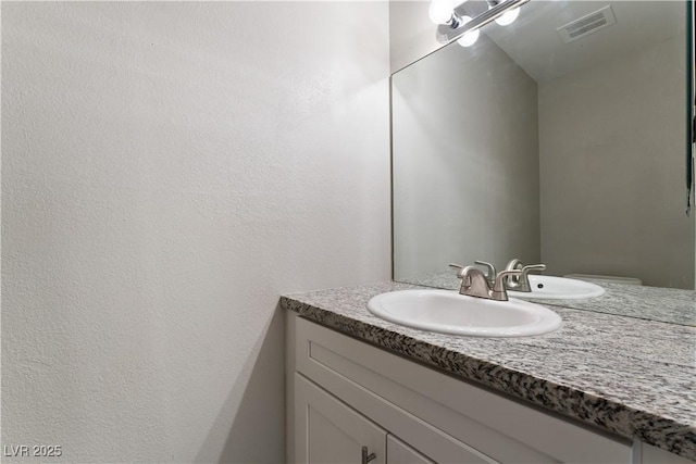 5939 Vegas Dr, Las Vegas, NV 89108 - bathroom with vanity and visible vents