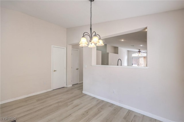 8136 Shady Glen Ave, Las Vegas, NV 89131 - unfurnished dining area with a chandelier and wood finished floors