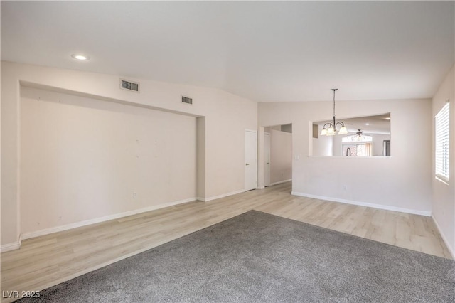 8136 Shady Glen Ave, Las Vegas, NV 89131 - unfurnished room featuring a chandelier, wood finished floors, and recessed lighting