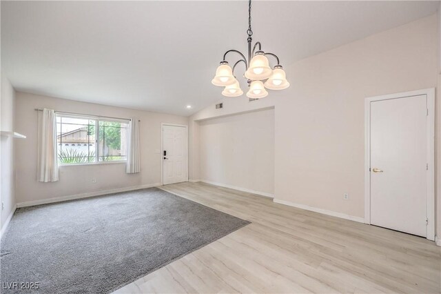 8136 Shady Glen Ave, Las Vegas, NV 89131 - entrance foyer featuring a chandelier, light wood-style flooring, and vaulted ceiling