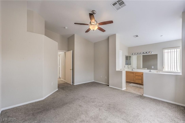 8136 Shady Glen Ave, Las Vegas, NV 89131 - unfurnished bedroom featuring light colored carpet, ensuite bath, and vaulted ceiling