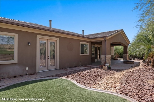 653 Paloma Cir, Mesquite, NV 89027 - back of house featuring a patio area, stucco siding, and french doors