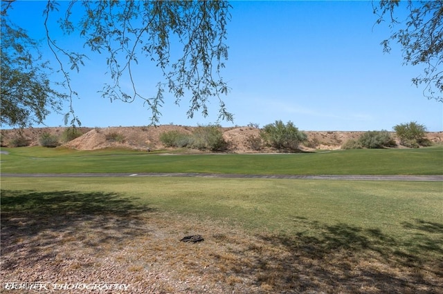 653 Paloma Cir, Mesquite, NV 89027 - surrounding community featuring view of golf course and a lawn