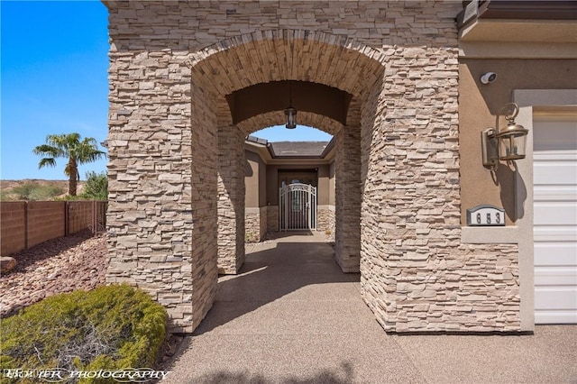 653 Paloma Cir, Mesquite, NV 89027 - doorway to property featuring stone siding and fence