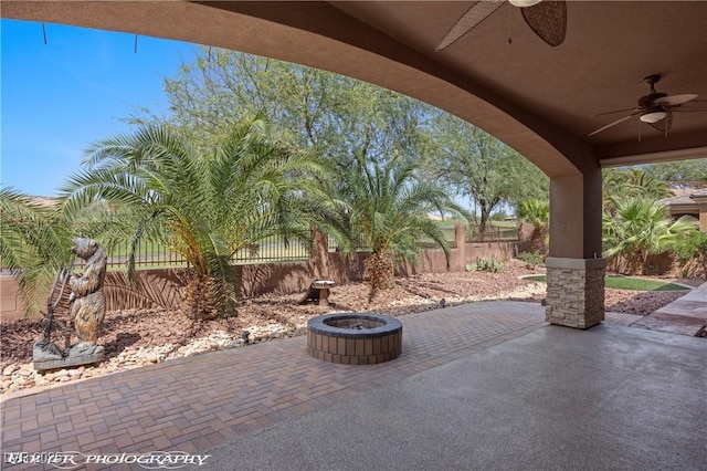 653 Paloma Cir, Mesquite, NV 89027 - view of patio / terrace featuring an outdoor fire pit, a fenced backyard, and ceiling fan