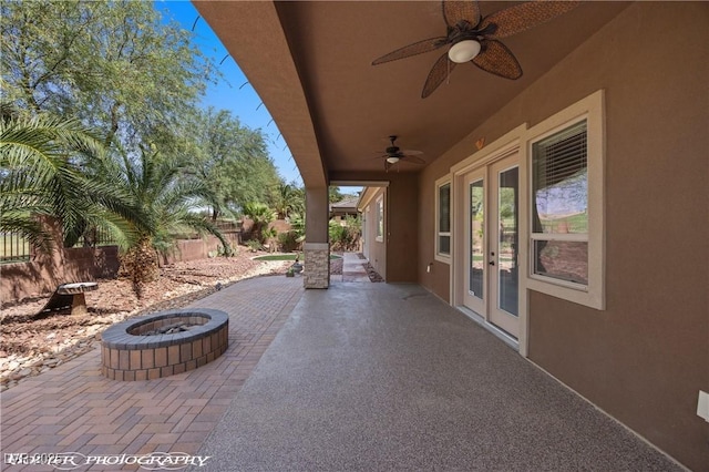653 Paloma Cir, Mesquite, NV 89027 - view of patio featuring an outdoor fire pit, a fenced backyard, french doors, and a ceiling fan