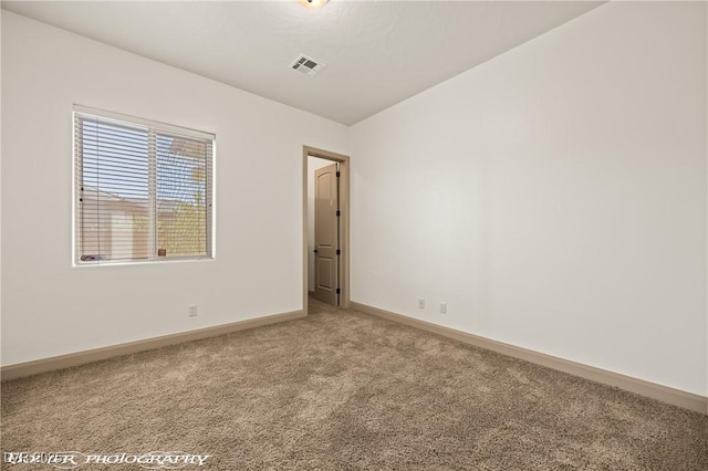 653 Paloma Cir, Mesquite, NV 89027 - empty room featuring light colored carpet, baseboards, and visible vents