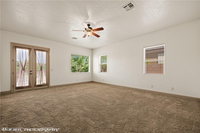 653 Paloma Cir, Mesquite, NV 89027 - carpeted spare room with a ceiling fan, baseboards, french doors, and visible vents
