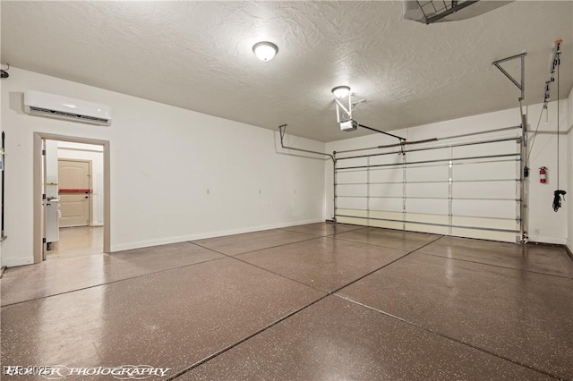 653 Paloma Cir, Mesquite, NV 89027 - garage with baseboards, a garage door opener, and an AC wall unit