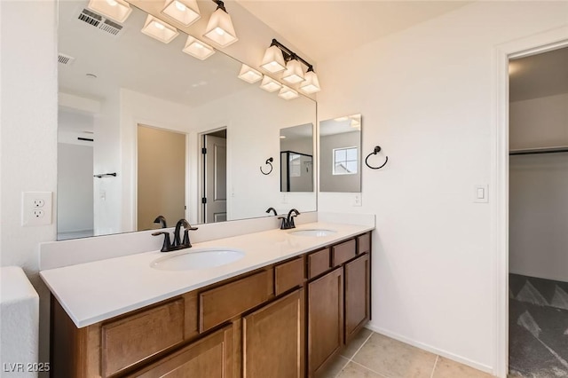 632 Cadence Vista Dr, Henderson, NV 89011 - bathroom with double vanity, tile patterned flooring, and a spacious closet