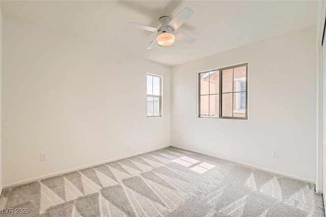 632 Cadence Vista Dr, Henderson, NV 89011 - spare room featuring light carpet, ceiling fan, and baseboards