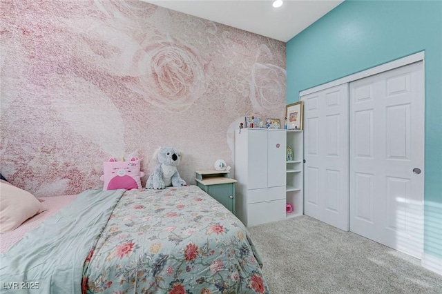 carpeted bedroom featuring a closet and recessed lighting