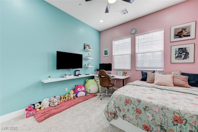 carpeted bedroom with visible vents and ceiling fan